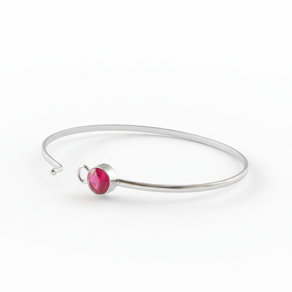Crimson modern silver bangle with red gemstone on wrist